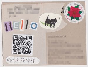 Back of postcard. Address is blurred. Kraft paper colored card has newsprint glued over it with a collage on the top. The collage spells 
