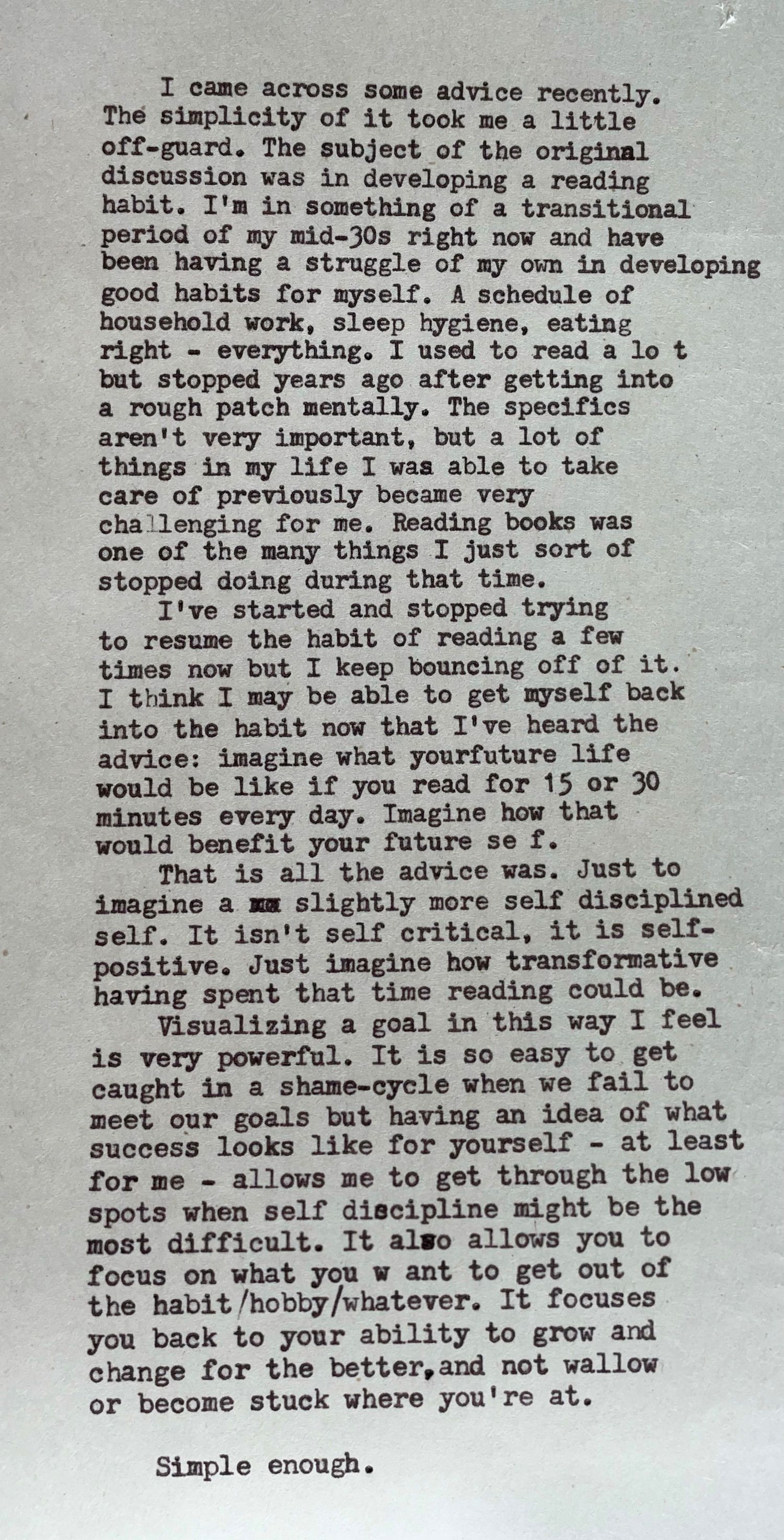 A panoramic photo of a message created by a typewriter on a sheet of newsprint.